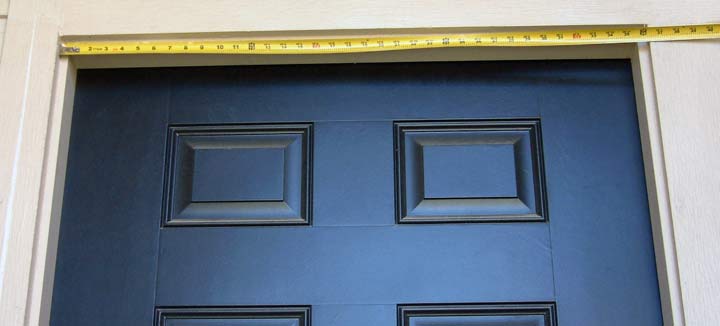 Picture of Standard Entry Doorway with Tape Measure Across Width of Opening at Top