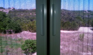 Up close of a double Plisse retractable screen's closure.