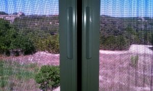 Double Plisse Retractable Screen Closure Up close of a double Plisse retractable screen's closure.